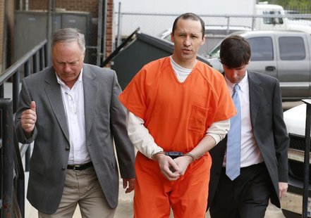 James Everett Dutschke, flanked by U.S. Marshals, arrives for a sentencing hearing at the United State Federal Building in Aberdeen, Mississ James Everett Dutschke, flanked by U.S. Marshals, arrives for a sentencing hearing at the United State Federal Building in Aberdeen, Mississ