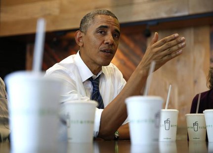 U.S. President Barack Obama talks while having lunch with construction workers at Shake Shack in Washington May 16, 2014. REUTERS/Kevin Lama U.S. President Barack Obama talks while having lunch with construction workers at Shake Shack in Washington May 16, 2014. REUTERS/Kevin Lama
