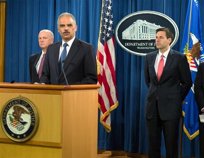 U.S. Attorney General Eric Holder (2nd L) announces the indictments of five Chinese nationals on cyber espionage charges for allegedly steal U.S. Attorney General Eric Holder (2nd L) announces the indictments of five Chinese nationals on cyber espionage charges for allegedly steal