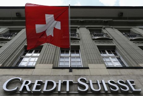 The logo of Swiss bank Credit Suisse is seen below the Swiss flag at a building in the Federal Square in Bern May 15, 2014. REUTERS/Ruben Sp The logo of Swiss bank Credit Suisse is seen below the Swiss flag at a building in the Federal Square in Bern May 15, 2014. REUTERS/Ruben Sp
