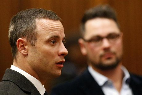 Olympic and Paralympic track star Oscar Pistorius (L) looks on next to his brother Carl at the end of his trial, at the North Gauteng High C Olympic and Paralympic track star Oscar Pistorius (L) looks on next to his brother Carl at the end of his trial, at the North Gauteng High C