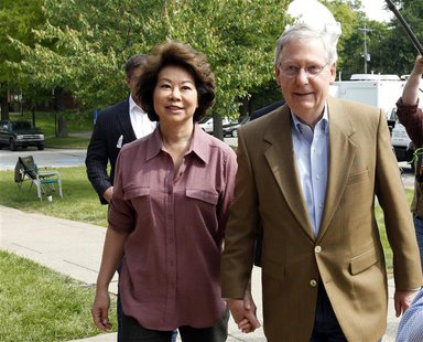 Senate Republican Leader Sen. Mitch McConnell (R-KY) and his wife Elaine Chao arrive at Bellarmine University to cast their ballots during K Senate Republican Leader Sen. Mitch McConnell (R-KY) and his wife Elaine Chao arrive at Bellarmine University to cast their ballots during K