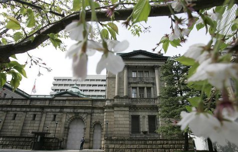 The Bank of Japan (BOJ) headquarters is seen through a cherry blossom tree in Tokyo April 9, 2008. REUTERS/Yuriko Nakao The Bank of Japan (BOJ) headquarters is seen through a cherry blossom tree in Tokyo April 9, 2008. REUTERS/Yuriko Nakao
