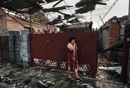 Yekaterina Len, 61, cries outside her destroyed house following what locals say was overnight shelling by Ukrainian forces in the outskirts Yekaterina Len, 61, cries outside her destroyed house following what locals say was overnight shelling by Ukrainian forces in the outskirts