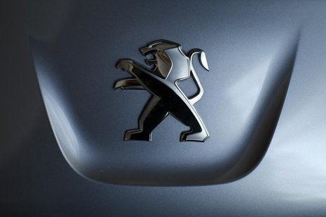 A Peugeot logo is seen on a car which is displayed at PSA Peugeot Citroen headquarters in Paris April 14, 2014. REUTERS/Benoit Tessier A Peugeot logo is seen on a car which is displayed at PSA Peugeot Citroen headquarters in Paris April 14, 2014. REUTERS/Benoit Tessier