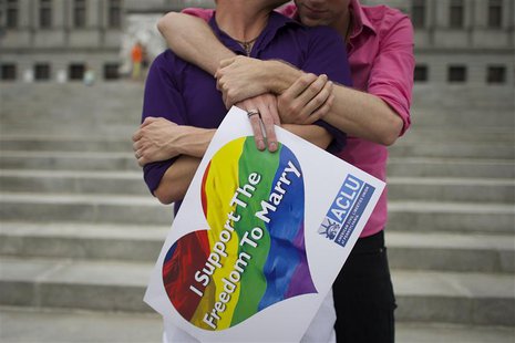 Mike Woods, 28, and Brandon Parsons, 30, embrace on the Pennsylvania State Capital steps following a rally with gay rights supporters after Mike Woods, 28, and Brandon Parsons, 30, embrace on the Pennsylvania State Capital steps following a rally with gay rights supporters after