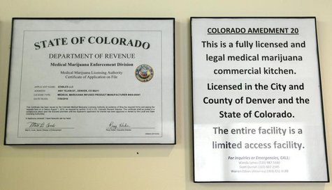 The license for the Simply Pure edible cannabis business hangs in the company kitchen in Denver, Colorado, May 25, 2012. REUTERS/Rick Wilkin The license for the Simply Pure edible cannabis business hangs in the company kitchen in Denver, Colorado, May 25, 2012. REUTERS/Rick Wilkin