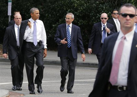 U.S. President Barack Obama (2nd L) walks with White House counselor John Podesta (C) as they were surrounded by agents of the U.S. Secret S U.S. President Barack Obama (2nd L) walks with White House counselor John Podesta (C) as they were surrounded by agents of the U.S. Secret S