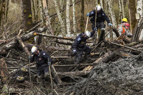 Rescuers search the large debris pile left by a mudslide in Oso, Washington, April 4, 2014. REUTERS/Max Whittaker Rescuers search the large debris pile left by a mudslide in Oso, Washington, April 4, 2014. REUTERS/Max Whittaker