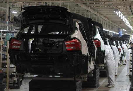 Thai workers work at a sedan line production at Honda Automobile in Rojana Industrial Park, Ayutthaya province, about 80 km (50 miles) north Thai workers work at a sedan line production at Honda Automobile in Rojana Industrial Park, Ayutthaya province, about 80 km (50 miles) north