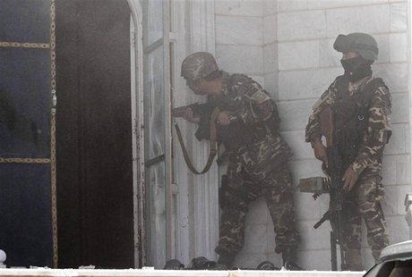 Afghan security forces take position at the scene of an attack on the Indian consulate in Herat province May 23 ,2014. REUTERS/Mohammad Shoi Afghan security forces take position at the scene of an attack on the Indian consulate in Herat province May 23 ,2014. REUTERS/Mohammad Shoi