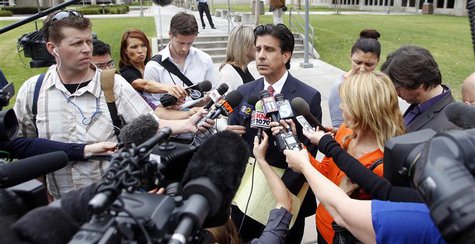 Attorney Charles Frisco (C) speaks during a news conference after a jailhouse video court hearing for Isidro Garcia in Santa Ana, California Attorney Charles Frisco (C) speaks during a news conference after a jailhouse video court hearing for Isidro Garcia in Santa Ana, California