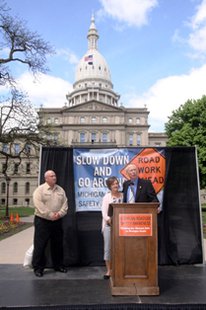 State Senator Bruce Caswell with Robin Creel, widow of killed Consumers Energy employee Jeff Creel, during a Slow Down and Go Ahead presentation at the Michigan State Capitol May 22, 2014 State Senator Bruce Caswell with Robin Creel, widow of killed Consumers Energy employee Jeff Creel, during a Slow Down and Go Ahead presentation at the Michigan State Capitol May 22, 2014