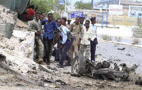 Somali government soldiers take their positions during a clash with Al Shabaab militants outside the Parliament buildings in the capital Mog Somali government soldiers take their positions during a clash with Al Shabaab militants outside the Parliament buildings in the capital Mog