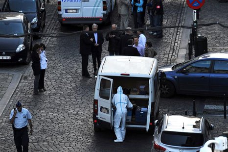 Police personnel are seen at the site of a shooting in central Brussels May 24, 2014. REUTERS/Eric Vidal Police personnel are seen at the site of a shooting in central Brussels May 24, 2014. REUTERS/Eric Vidal