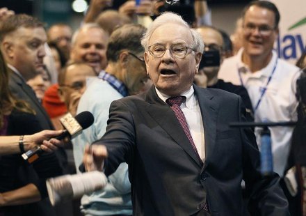 Berkshire Hathaway CEO Warren Buffett throws a newspaper during a competition at a trade show, at the company's annual meeting in Omaha, Neb Berkshire Hathaway CEO Warren Buffett throws a newspaper during a competition at a trade show, at the company's annual meeting in Omaha, Neb