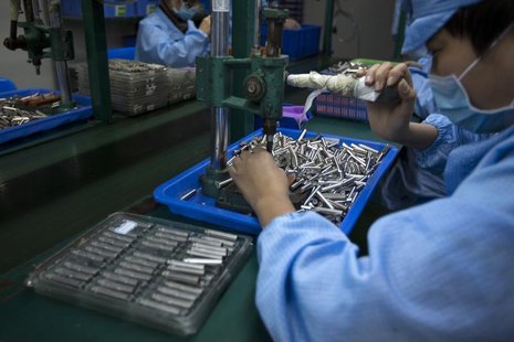 Employees work on electronic cigarettes at a production line in a factory in Shenzhen, southern Chinese province of Guangdong January 15, 20 Employees work on electronic cigarettes at a production line in a factory in Shenzhen, southern Chinese province of Guangdong January 15, 20