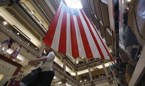 A shopper walks past a giant U.S. flag on display, ahead of the Memorial Day holiday, in a department store in Chicago, Illinois, May 23, 20 A shopper walks past a giant U.S. flag on display, ahead of the Memorial Day holiday, in a department store in Chicago, Illinois, May 23, 20