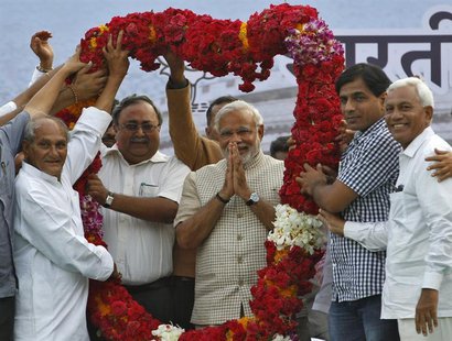 Hindu nationalist Narendra Modi, the prime ministerial candidate for India's main opposition Bharatiya Janata Party (BJP), gestures as he re Hindu nationalist Narendra Modi, the prime ministerial candidate for India's main opposition Bharatiya Janata Party (BJP), gestures as he re