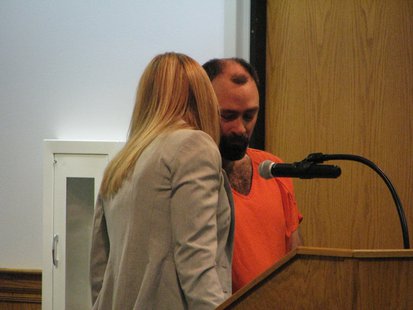 Evan Mooney consults with attorney Kathryn Jackan. Evan Mooney consults with attorney Kathryn Jackan.