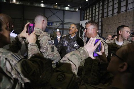 Soldiers take photos as U.S. President Barack Obama (C) shakes hands with troops after delivering remarks at Bagram Air Base in Kabul, May 25, 2014. CREDIT: REUTERS/JONATHAN ERNST Soldiers take photos as U.S. President Barack Obama (C) shakes hands with troops after delivering remarks at Bagram Air Base in Kabul, May 25, 2014. CREDIT: REUTERS/JONATHAN ERNST