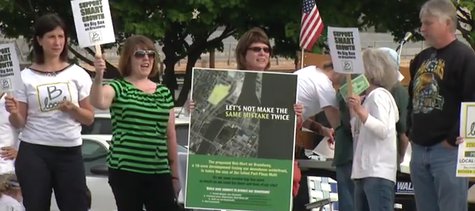 Protesters gather outside Walmart's neighborhood meeting at Neville Public Museum on May 27, 2014. (Photo from: FOX 11/YouTube). Protesters gather outside Walmart's neighborhood meeting at Neville Public Museum on May 27, 2014. (Photo from: FOX 11/YouTube).