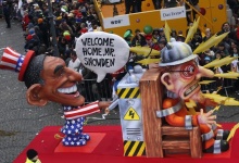 A parade float depicting President Obama throwing the switch of Edward Snowden. Reuters/Ina Fassbender A parade float depicting President Obama throwing the switch of Edward Snowden. Reuters/Ina Fassbender