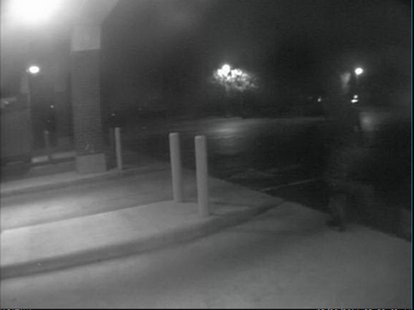 Image of suspect fleeing the Macatawa Bank branch on E. 16th Street in Holland after a robbery on May 30, 2014. (photo courtesy Holland Public Safety) Image of suspect fleeing the Macatawa Bank branch on E. 16th Street in Holland after a robbery on May 30, 2014. (photo courtesy Holland Public Safety)