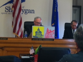 Mayor Vandersteen shows off gift of artwork from Esslingen. Mayor Vandersteen shows off gift of artwork from Esslingen.