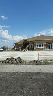 Crane tips on funeral home building under construction in West Fargo Crane tips on funeral home building under construction in West Fargo