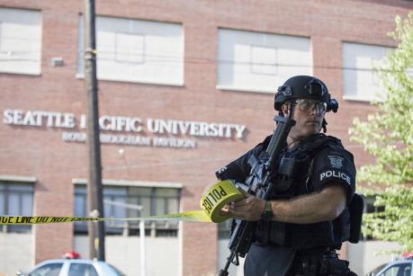 A policeman secures the scene at Seattle Pacific University after the campus was evacuated due to a shooting in Seattle, Washington June 5, 2014. A policeman secures the scene at Seattle Pacific University after the campus was evacuated due to a shooting in Seattle, Washington June 5, 2014.