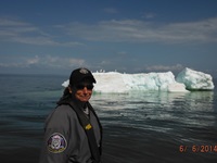 Marine Warden Amie Egstad with a Lake Superior iceberg in the background Photo: Wisconsin DNR
Marine Warden Amie Egstad with a Lake Superior iceberg in the background Photo: Wisconsin DNR