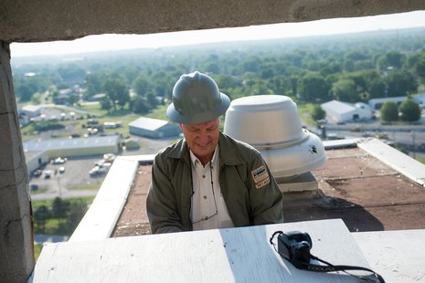 John Castrale, nongame bird biologist for Indiana Department of Natural Resources Division of Fish and Wildlife, cleans out the peregrine falcon nest box on the rooftop of Indiana State University’s now vacant Statesman Towers on May 28. John Castrale, nongame bird biologist for Indiana Department of Natural Resources Division of Fish and Wildlife, cleans out the peregrine falcon nest box on the rooftop of Indiana State University’s now vacant Statesman Towers on May 28.
