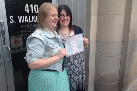 Natalie, left, and Heather Starr pose in front of the Outagamie County Administration Building in Appleton with their marriage license June 9, 2014. The Starrs were the first same-sex couple to be legally married in Outagamie County. (Photo from: FOX 11.) Natalie, left, and Heather Starr pose in front of the Outagamie County Administration Building in Appleton with their marriage license June 9, 2014. The Starrs were the first same-sex couple to be legally married in Outagamie County. (Photo from: FOX 11.)