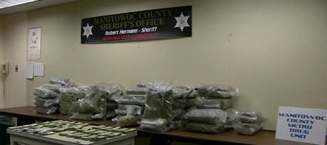 Manitowoc County Metro Drug Unit unveils seizures during weekend drug bust. (Photo from: FOX 11/YouTube). Manitowoc County Metro Drug Unit unveils seizures during weekend drug bust. (Photo from: FOX 11/YouTube).