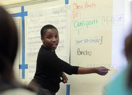 Trainee math teacher Mia Shaw from the Teach for America program teaches a class at George Washington Carver Middle School in Los Angeles, California July 18, 2012.
CREDIT: REUTERS/MARIO ANZUONI Trainee math teacher Mia Shaw from the Teach for America program teaches a class at George Washington Carver Middle School in Los Angeles, California July 18, 2012.
CREDIT: REUTERS/MARIO ANZUONI