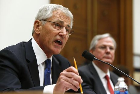 U.S. Defense Secretary Chuck Hagel (L) testifies with Defense Department General Counsel Stephen Preston (R) about the Bergdahl prisoner exchange at a House Armed Services Committee hearing on Capitol Hill in Washington June 11, 2014.
CREDIT: REUTERS/JONATHAN ERNST U.S. Defense Secretary Chuck Hagel (L) testifies with Defense Department General Counsel Stephen Preston (R) about the Bergdahl prisoner exchange at a House Armed Services Committee hearing on Capitol Hill in Washington June 11, 2014.
CREDIT: REUTERS/JONATHAN ERNST