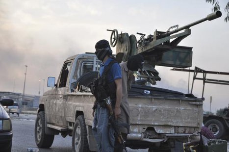 Fighters of the Islamic State of Iraq and the Levant (ISIL) stand guard at a checkpoint in the northern Iraq city of Mosul, June 11, 2014. CREDIT: REUTERS/STRINGER Fighters of the Islamic State of Iraq and the Levant (ISIL) stand guard at a checkpoint in the northern Iraq city of Mosul, June 11, 2014. CREDIT: REUTERS/STRINGER