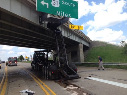 Scene of where a truck's hydraulic lift damaged a bridge carrying US-31 southbound traffic over Washington Avenue in Holland, MI on June 10, 2014 (photo courtesy Michigan Department of Transportation) Scene of where a truck's hydraulic lift damaged a bridge carrying US-31 southbound traffic over Washington Avenue in Holland, MI on June 10, 2014 (photo courtesy Michigan Department of Transportation)