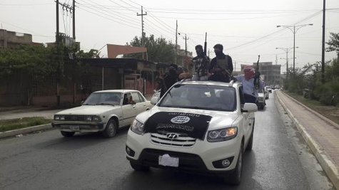 Fighters of the Islamic State of Iraq and the Levant (ISIL) celebrate on vehicles taken from Iraqi security forces, at a street in city of Mosul, June 12, 2014. CREDIT: REUTERS/STRINGER Fighters of the Islamic State of Iraq and the Levant (ISIL) celebrate on vehicles taken from Iraqi security forces, at a street in city of Mosul, June 12, 2014. CREDIT: REUTERS/STRINGER