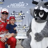 NASCAR Sprint Cup Series driver Kevin Harvick celebrates his 204.557 mph winning pole speed at Michigan International Speedway on June 13, 2014, with his son Keelan and the Bandit Chippers bandit. Photo by: LAT USA. NASCAR Sprint Cup Series driver Kevin Harvick celebrates his 204.557 mph winning pole speed at Michigan International Speedway on June 13, 2014, with his son Keelan and the Bandit Chippers bandit. Photo by: LAT USA.