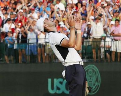 Martin Kaymer of Germany reacts after sinking his putt on the 18th green during the final round of the U.S. Open Championship golf tournament in Pinehurst, North Carolina, June 15, 2014. REUTERS/Mike Segar Martin Kaymer of Germany reacts after sinking his putt on the 18th green during the final round of the U.S. Open Championship golf tournament in Pinehurst, North Carolina, June 15, 2014. REUTERS/Mike Segar