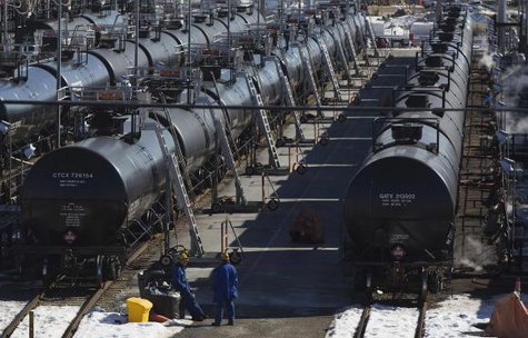 Irving Oil workers inspect rail cars carrying crude oil at the Irving Oil rail yard terminal in Saint John, New Brunswick in this March 9, 2014 file photo.
CREDIT: REUTERS/DEVAAN INGRAHAM/FILES Irving Oil workers inspect rail cars carrying crude oil at the Irving Oil rail yard terminal in Saint John, New Brunswick in this March 9, 2014 file photo.
CREDIT: REUTERS/DEVAAN INGRAHAM/FILES