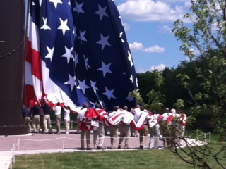 The huge flag is attached and raised The huge flag is attached and raised