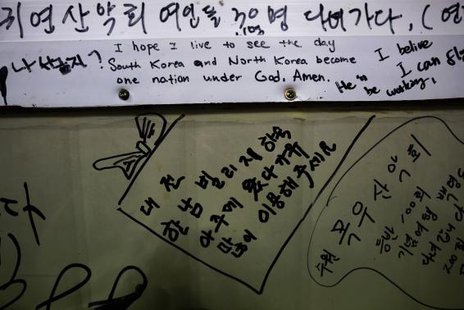 A pro-unification message is seen on a wall in a small fisherman's restaurant on the island of Baengnyeong, which lies on the South Korean side of the Northern Limit Line (NLL), in the Yellow Sea in More...
CREDIT: REUTERS/DAMIR SAGOLJ/FILES A pro-unification message is seen on a wall in a small fisherman's restaurant on the island of Baengnyeong, which lies on the South Korean side of the Northern Limit Line (NLL), in the Yellow Sea in More...
CREDIT: REUTERS/DAMIR SAGOLJ/FILES