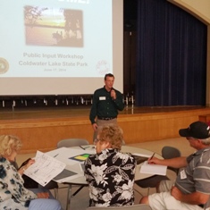 A Michigan Department of Natural Resources official presents information at a Coldwater Lake State Park meeting at Coldwater High School, June 17, 2014 A Michigan Department of Natural Resources official presents information at a Coldwater Lake State Park meeting at Coldwater High School, June 17, 2014
