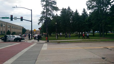 Students are being moved out of Green Bay East High School following a report of a gun inside the school on Monday June 23, 2014. (Copyright Midwest Communications, Inc.) Students are being moved out of Green Bay East High School following a report of a gun inside the school on Monday June 23, 2014. (Copyright Midwest Communications, Inc.)
