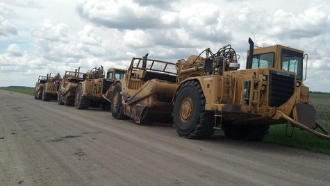 Heavy equipment staged for Oxbow ring dike Heavy equipment staged for Oxbow ring dike
