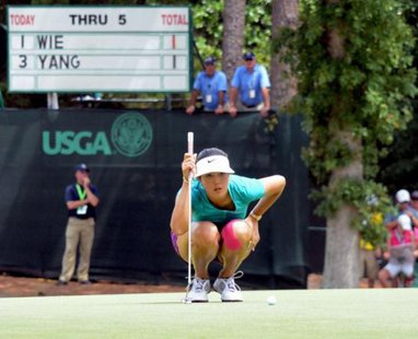 Jun 22, 2014; Pinehurst, NC, USA; Michelle Wie reads a birdie putt on the sixth hole during the final round of the U.S. Women's Open at the Pinehurst Resort and Country Club-#2 Course. Mandatory Credit: Rob Kinnan-USA TODAY Sports Jun 22, 2014; Pinehurst, NC, USA; Michelle Wie reads a birdie putt on the sixth hole during the final round of the U.S. Women's Open at the Pinehurst Resort and Country Club-#2 Course. Mandatory Credit: Rob Kinnan-USA TODAY Sports