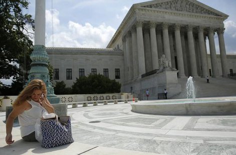 A woman uses her mobile phone at the plaza of the U.S. Supreme Court in Washington June 25, 2014.
CREDIT: REUTERS/GARY CAMERON A woman uses her mobile phone at the plaza of the U.S. Supreme Court in Washington June 25, 2014.
CREDIT: REUTERS/GARY CAMERON